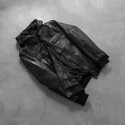 
Styled Fit Perspective of Men's Bouncer Biz Black Leather Hooded Bomber Jacket on Model - Natural Daylight Drape