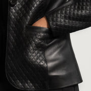 Close-Up Detail of Notch &amp; Button Hardware on Women's Cora Quilted Black Leather Blazer