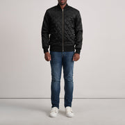 
Close-Up Detail of Varsity & Zipper Hardware on Danson Quilted Black Varsity Jacket