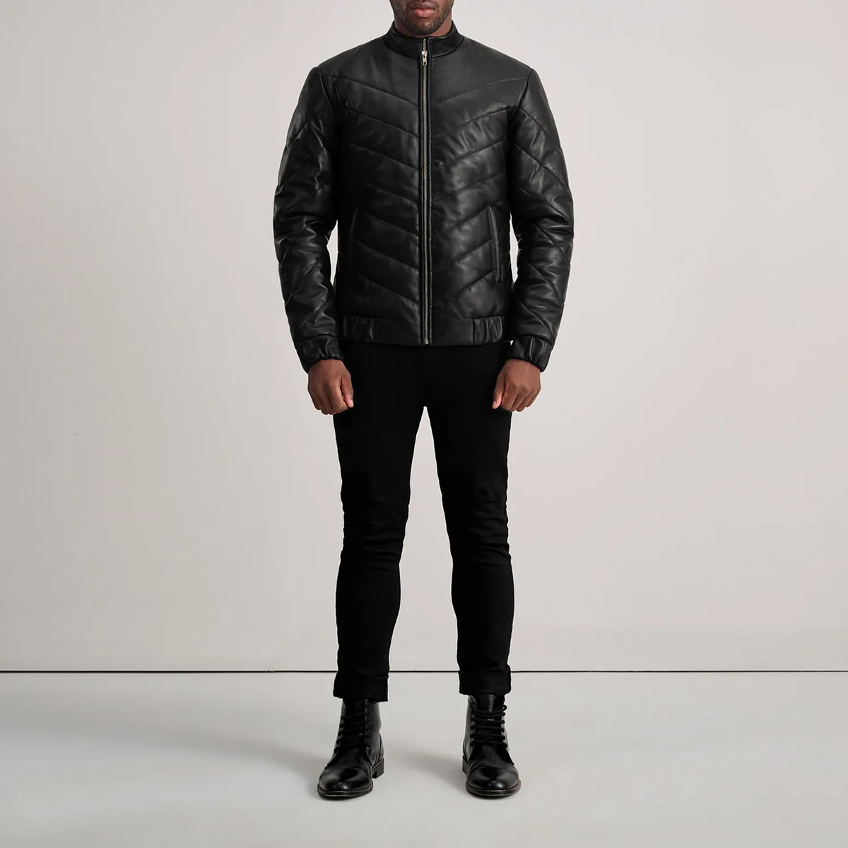 
Travis Black Leather Puffer Jacket - Lateral Side Profile View Showing Sleeve Cut & Athletic Taper Fit